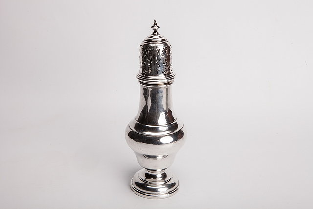 Appraisal: A GEORGIAN STYLE SILVER CASTER of baluster form with pedestal