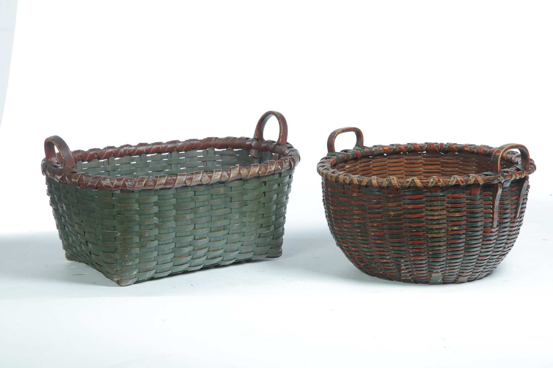 Appraisal: TWO AMERICAN PAINTED BASKETS Late th-early th century woven splint