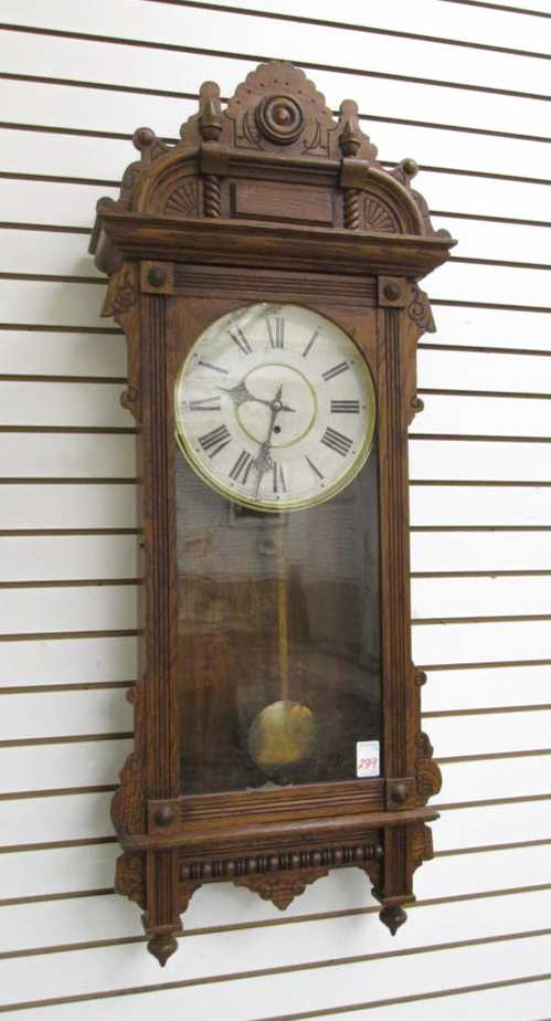 Appraisal: A LARGE OAK CASED WALL CLOCK Cambridge model by Waterbury