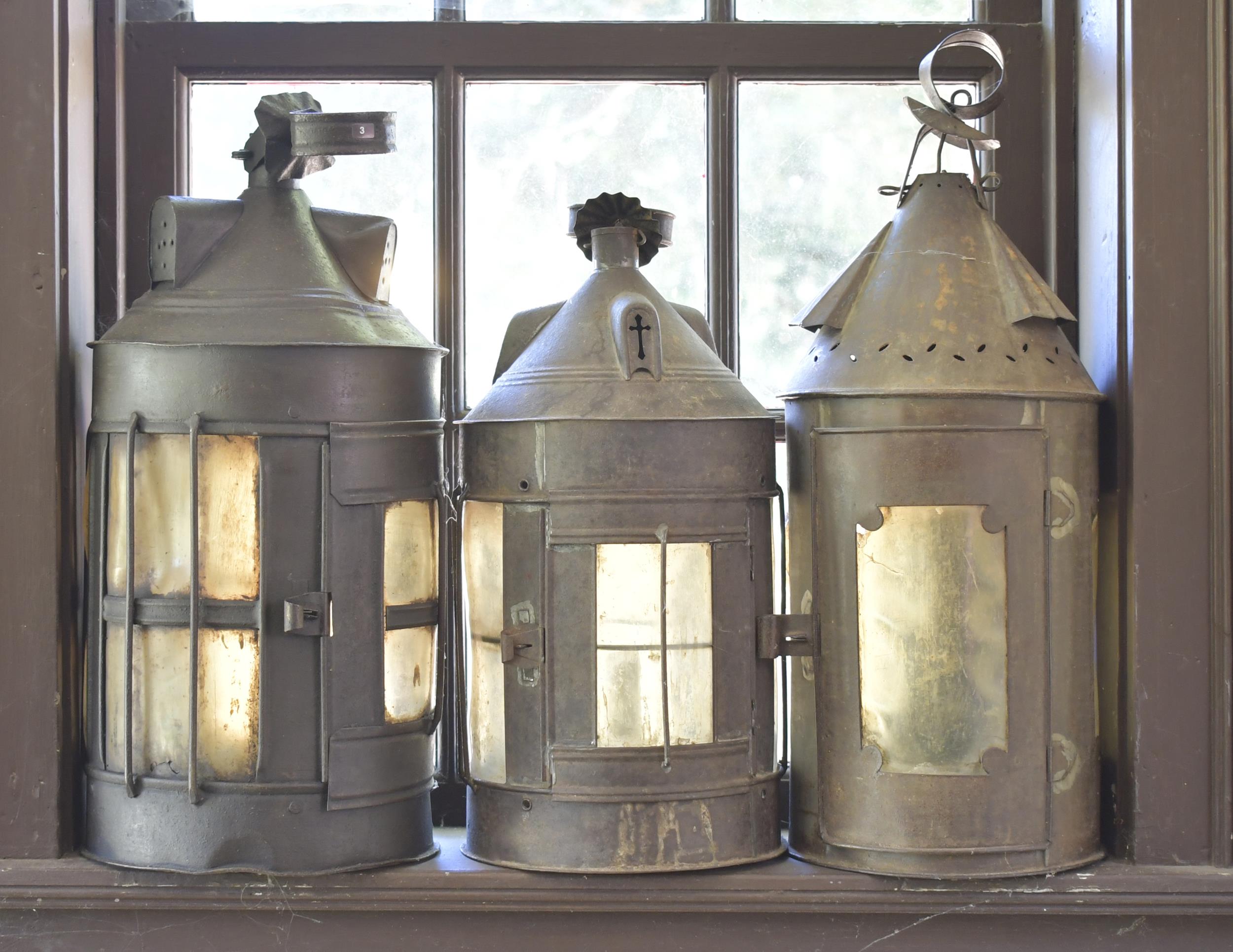 Appraisal: THREE EARLY TIN LANTERNS Three early and unique tin lanterns