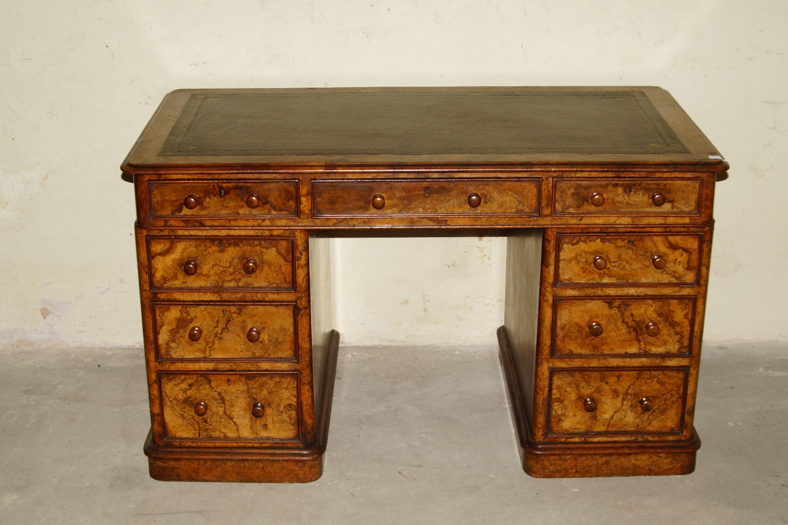 Appraisal: A Victorian figured and burr walnut twin pedestal desk with