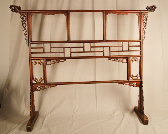 Appraisal: A Chinese Floor Standing Cloth Hanger with numerous carved elements