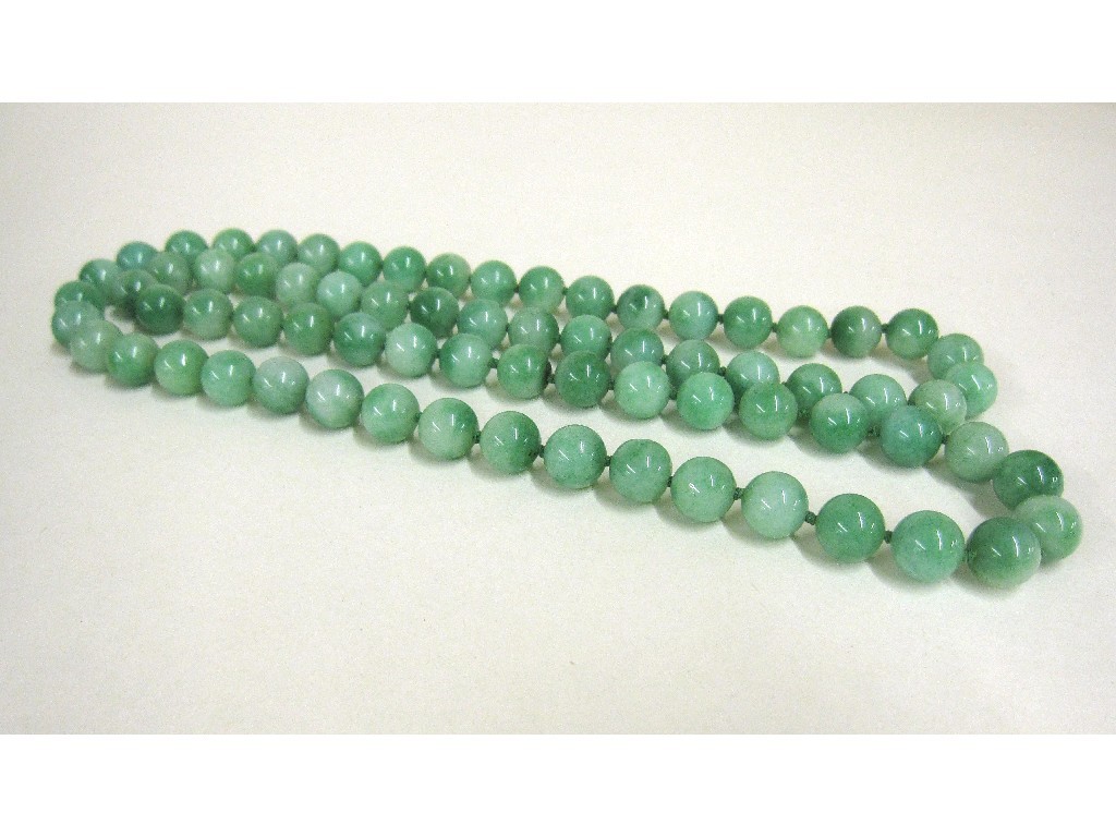 Appraisal: Long string of jade beads Approx cm