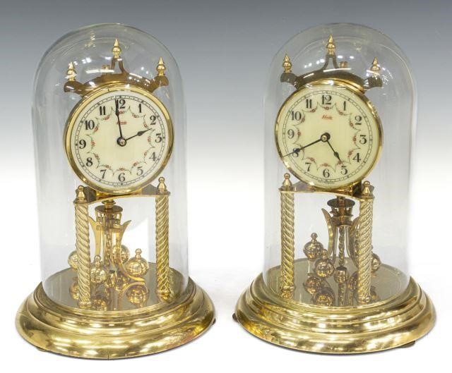 Appraisal: lot of German gilt metal torsion pendulum anniversary clocks mid