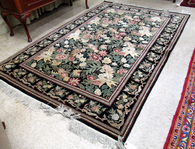 Appraisal: HAND KNOTTED ORIENTAL CARPET Pakistani-Persian overall foliate design on black