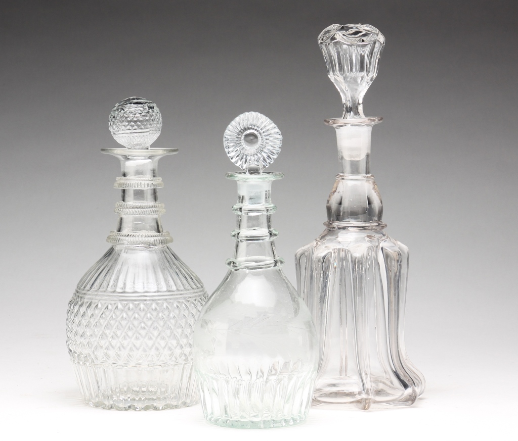 Appraisal: THREE AMERICAN GLASS DECANTERS First half th century Three mold