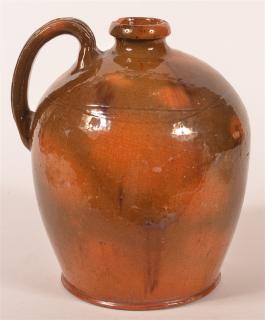 Appraisal: th C Strap Handle Multi-Glaze Redware Jug with Incised Bands