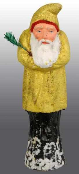 Appraisal: German Belsnickle Santa Figure Description Has a yellow coat One