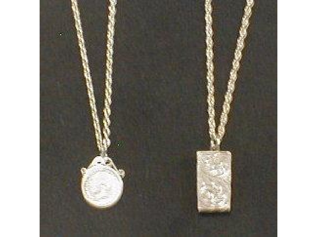 Appraisal: Two silver pendants