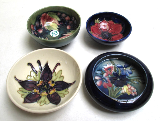 Appraisal: FOUR MOORCROFT POTTERY BOWLS each hand painted under glaze footed