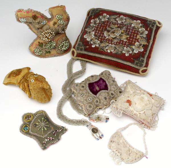 Appraisal: VICTORIAN BEADWORK Eight pieces including pincushions pillows a belt and