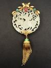 Appraisal: PENDANT - Circular mutton fat jade pendant carved with figural