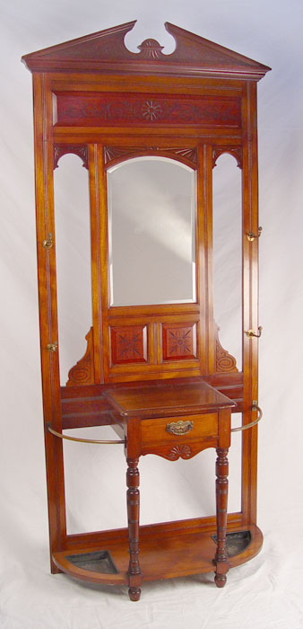 Appraisal: VICTORIAN WALNUT HALL STAND Centering a beveled mirror and drawers