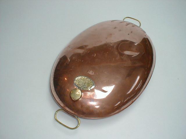 Appraisal: A Victorian polished copper foot warmer