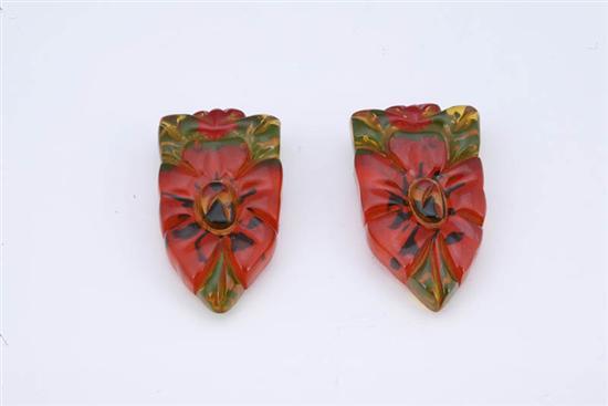 Appraisal: PAIR OF BAKELITE CLIPS Carved applejuice clips with reverse painted