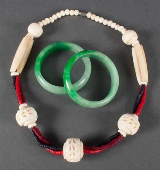 Appraisal: Chinese carved bone bead necklace and two jade bangle bracelets