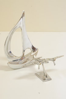 Appraisal: CHROME PLATED DECO STYLE MODELLED PLANE AND BOAT