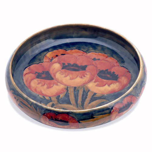 Appraisal: MOORCROFT Large center bowl in the Poppy pattern Stamped MOORCROFT