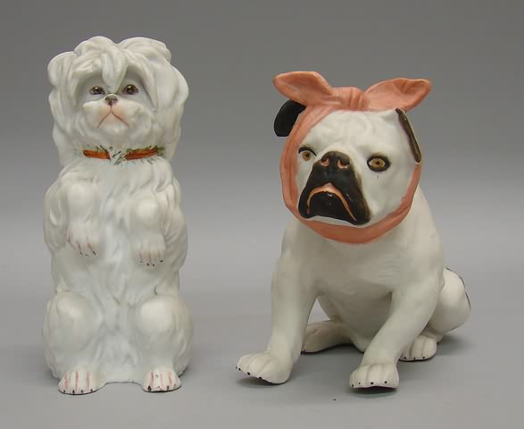 Appraisal: Pair of German bisque dog figurines Bull dog with scarf