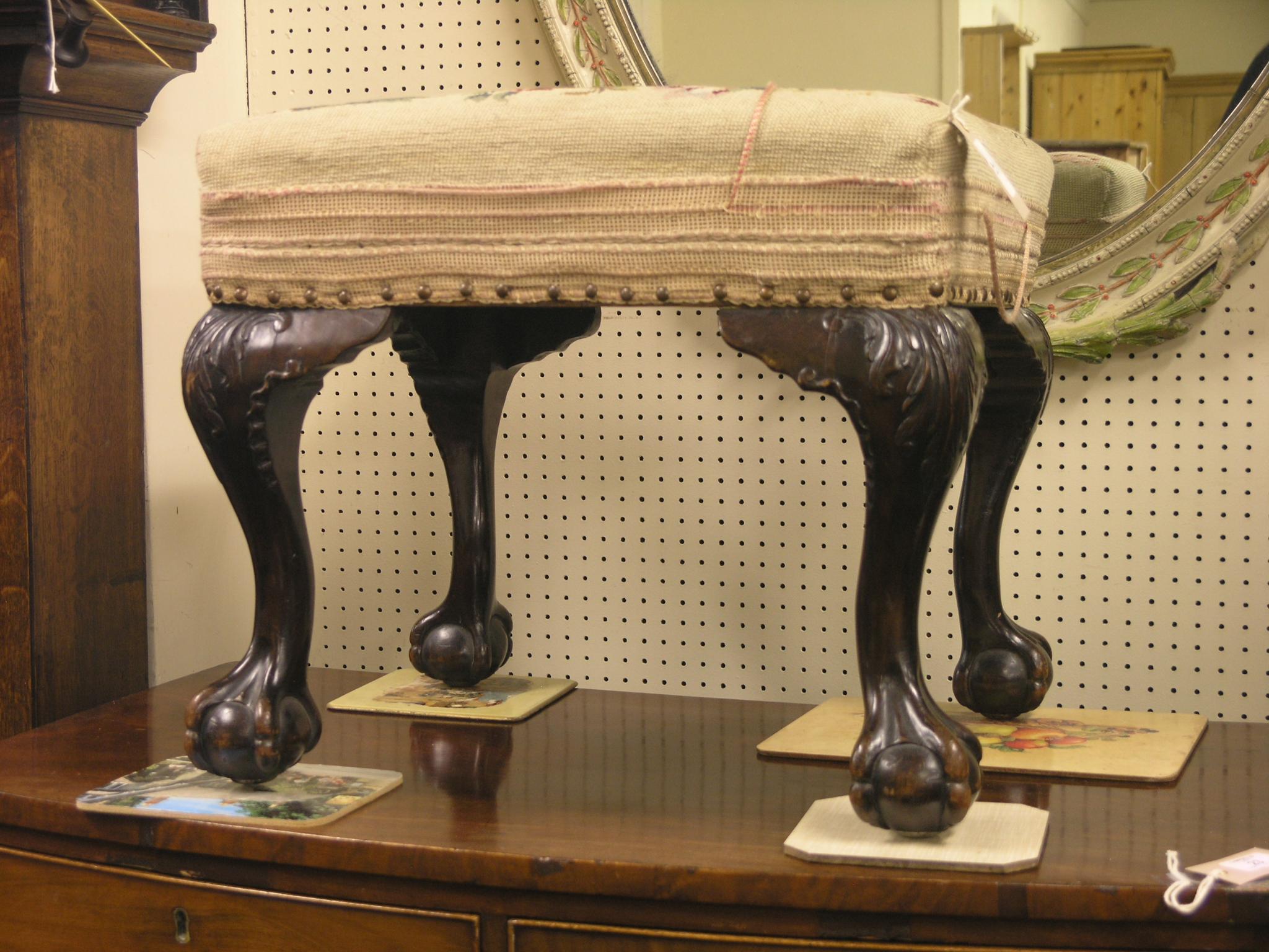 Appraisal: A Chippendale-style mahogany stool rectangular-shape with petit-point needlework carved cabriole