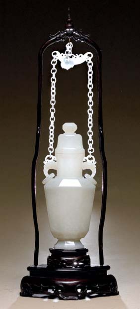 Appraisal: WHITE JADE CHAIN VASE Chinese carved pure white jade footed