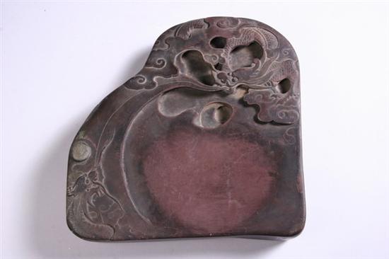 Appraisal: CHINESE PURPLE DUAN INKSTONE Carved with two dragons chasing a