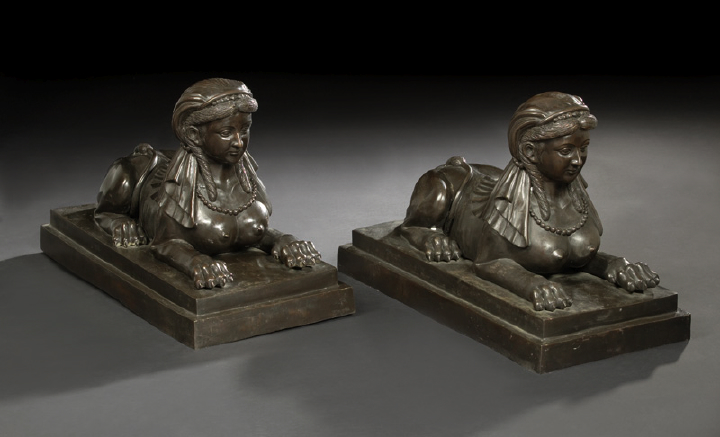 Appraisal: Large Pair of Continental Patinated Bronze Figures of Recumbent Bare-Breasted