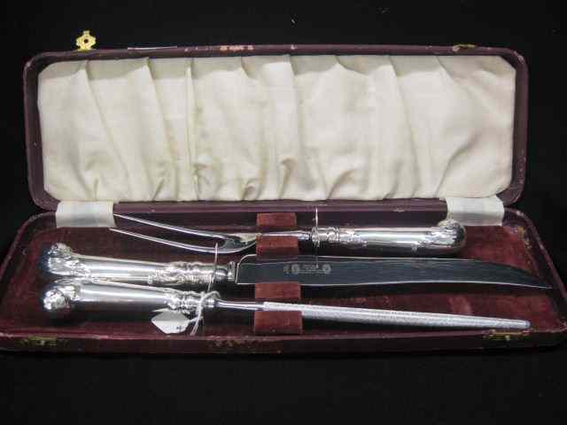 Appraisal: English Silverplate Carving Set pistol grip handles roast size knife