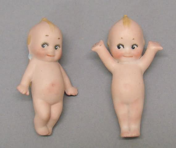 Appraisal: All bisque Kewpie Place Card Holder Pair of Kewpie dolls