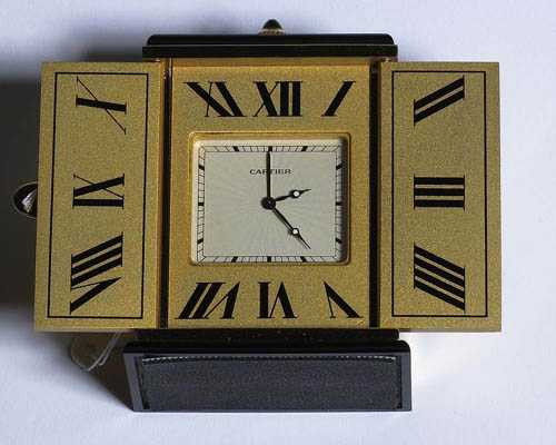 Appraisal: ONYX MINIATURE PENDULETTE CLOCK CARTIER TRIPTYQUE from the s Gold-plated