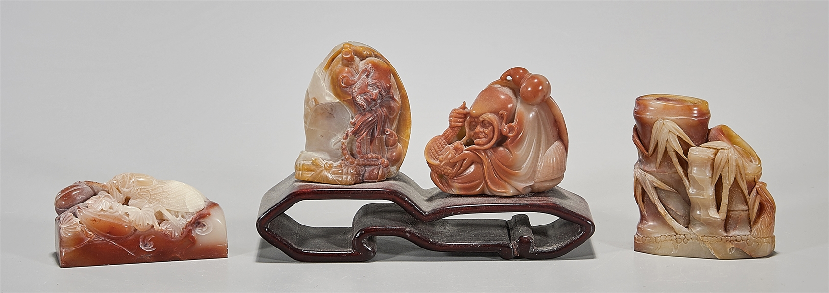 Appraisal: Four Chinese soapstone carvings including two figures bamboo and cicada