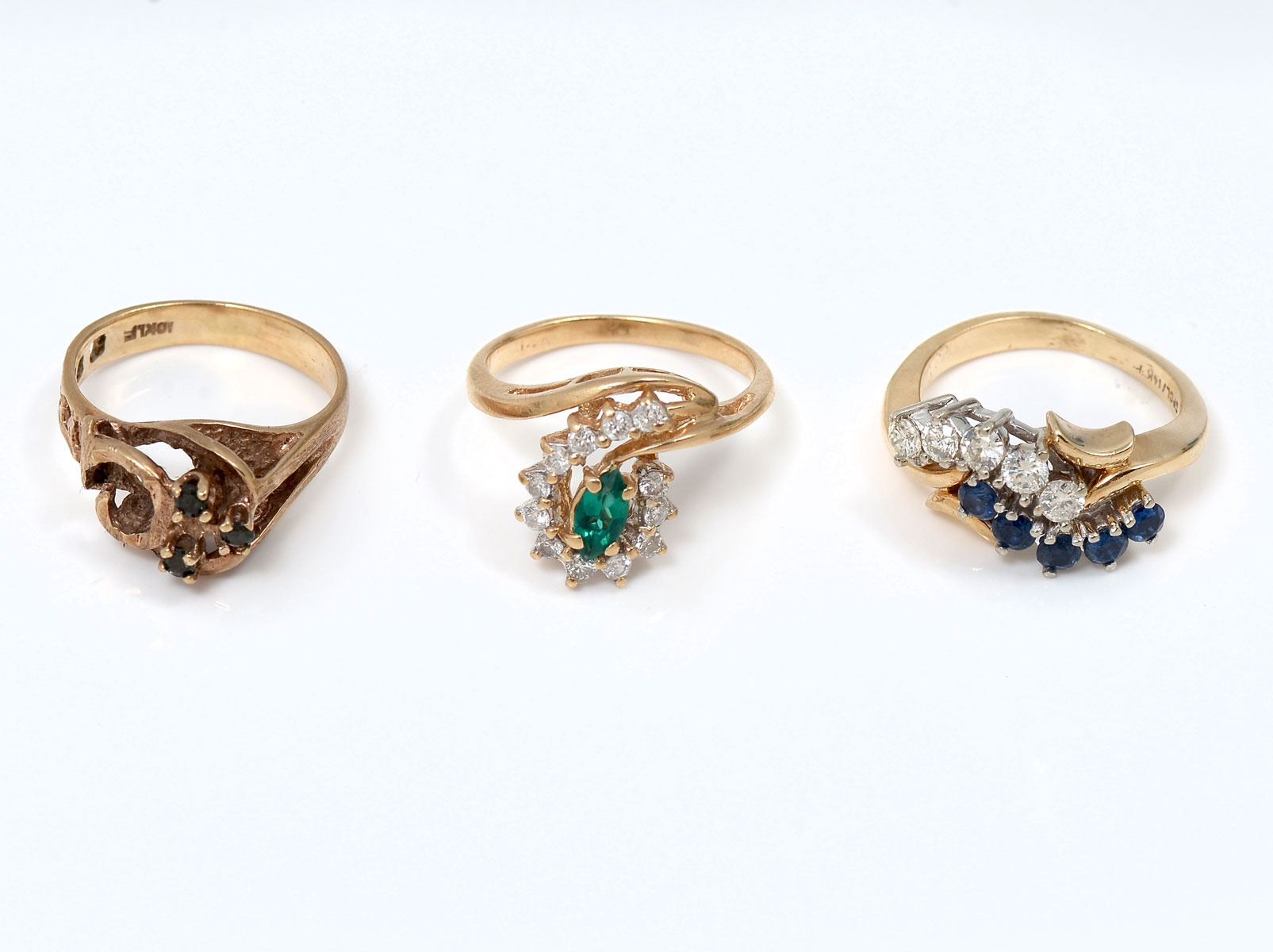 Appraisal: LOT OF GEMSTONE RINGS Three K yellow gold rings contain