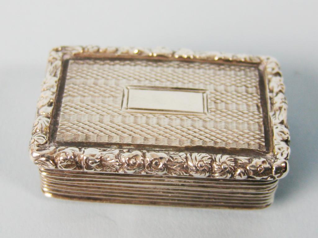 Appraisal: A Georgian rectangular Vinaigrette with engine turning and cast floral