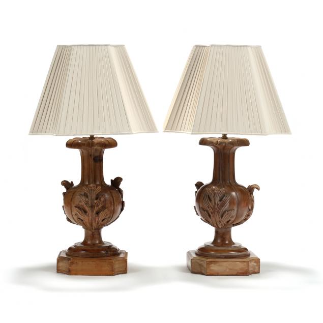 Appraisal: A PAIR OF ITALIAN CARVED WOOD VASE FORM TABLE LAMPS