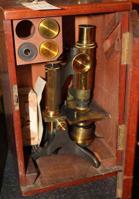 Appraisal: A th century lacquered brass microscope by Baker High Holborn