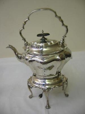 Appraisal: AN EDWARDIAN SPIRIT KETTLE ON STAND of shaped inverted baluster