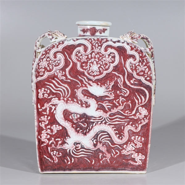 Appraisal: Chinese red and white vase with ornate applied dragons to