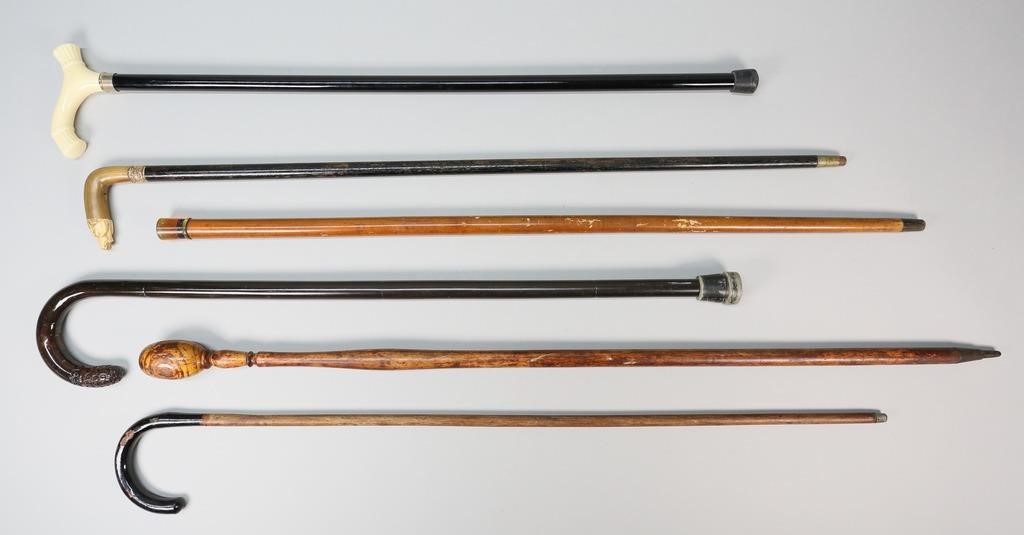 Appraisal: Lot of canes and walking sticks with carved wood handles