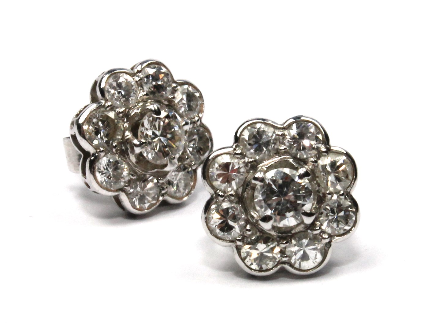 Appraisal: A pair of diamond set nine stone cluster earstuds each