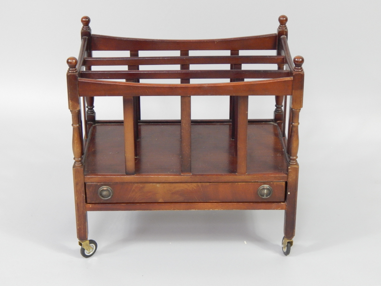 Appraisal: A mahogany three division Canterbury with single frieze drawer raised