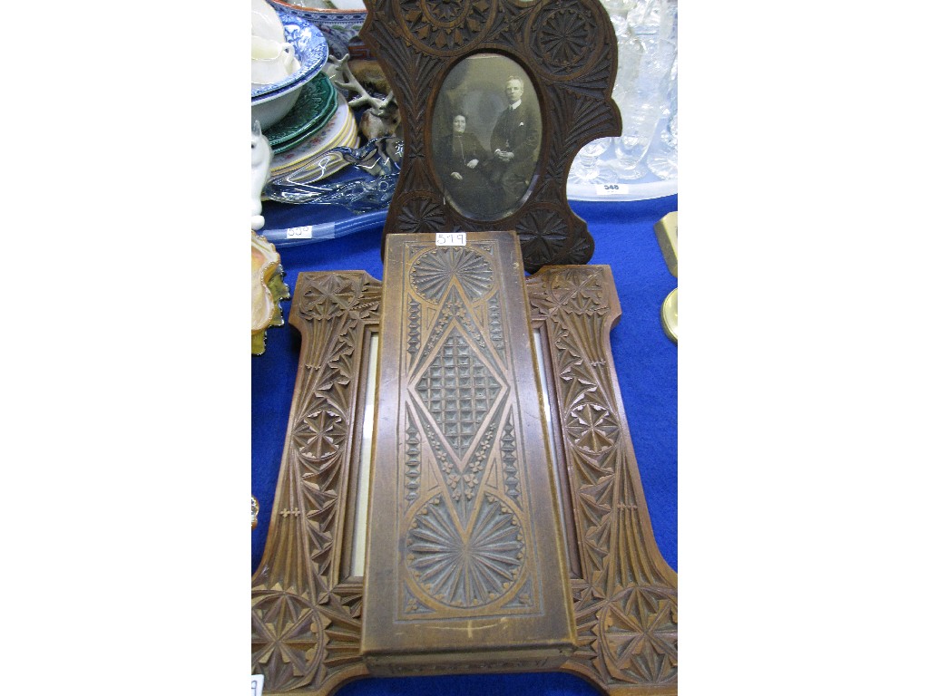 Appraisal: Two carved wooden photographs framed and a similar box