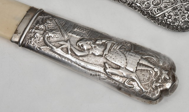 Appraisal: A VICTORIAN SILVER AND IVORY PAGE TURNER the handle decorated