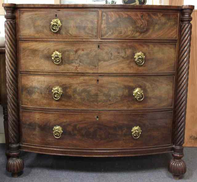 Appraisal: An early th Century mahogany bowfront chest of three long