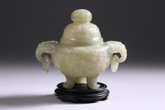 Appraisal: CHINESE CELADON JADE TRIPOD CENSER Qing Dynasty Carved to depict