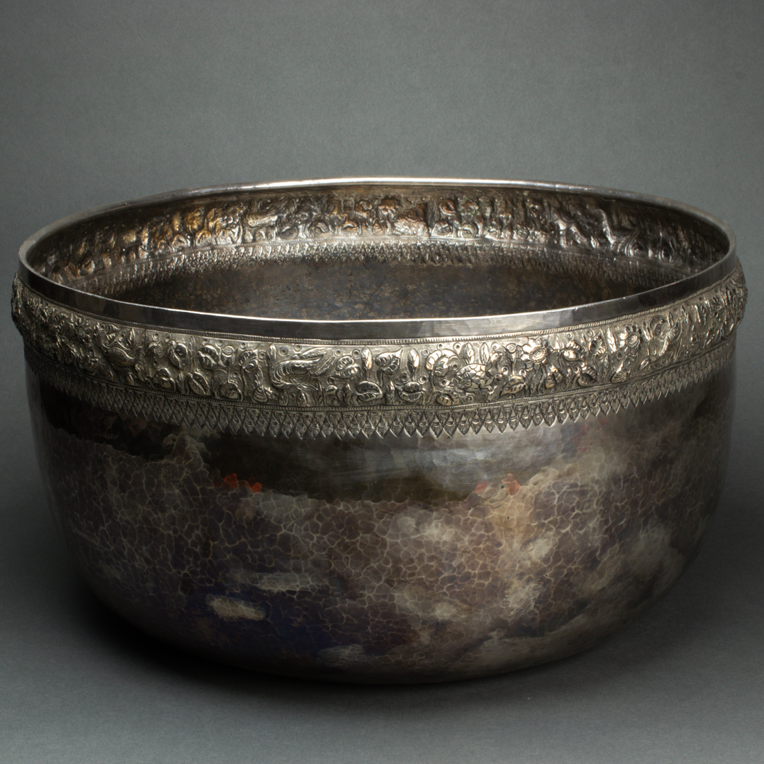 Appraisal: BURMESE SILVER CEREMONIAL BOWL Burmese silver ceremonial bowl the rim