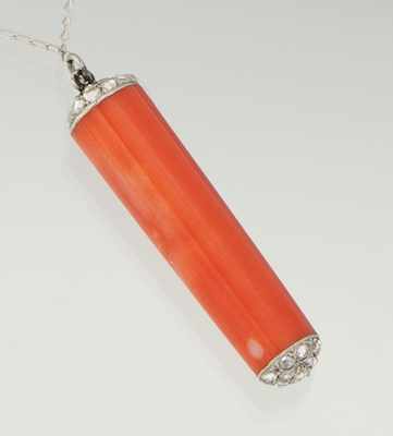 Appraisal: A Coral and Diamond Pendant Cylinder shape pendant capped on