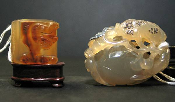 Appraisal: Two agate carvings The first a Suzhou style reticulated toggle