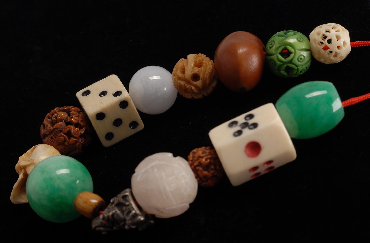 Appraisal: STRING OF FIFTEEN OJIME AND OTHER BEADS Three jadeite beads