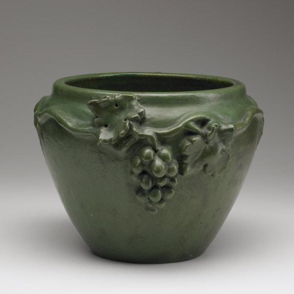 Appraisal: ROOKWOOD FAIENCE Jardiniere with grapevines under matte green glaze Touch-ups