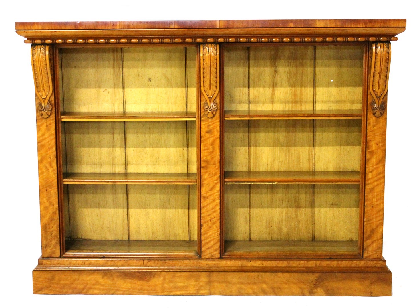 Appraisal: A th century satinwood floor standing two section open bookcase